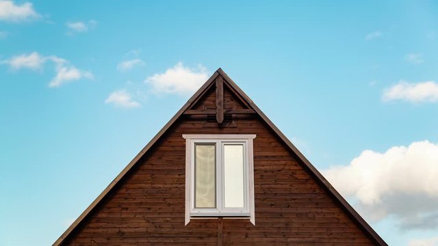 house roof and background with sky and clouds time lapse 4k