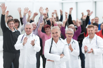 Fototapeta na wymiar Group doctors and patients clapping their hands to celebrate recovery