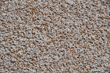 close view of the wall surface, decorative finishing, heat insulation granules or granite particles
