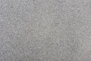 Close up small tiny stone pebble in concrete floor texture background