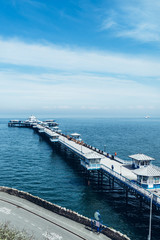 Naklejka premium Beautiful Summer Day in Llandudno Sea Front and empty Pier in North Wales, United Kingdom