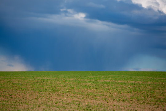 Dark clouds over field before a tunderstorm