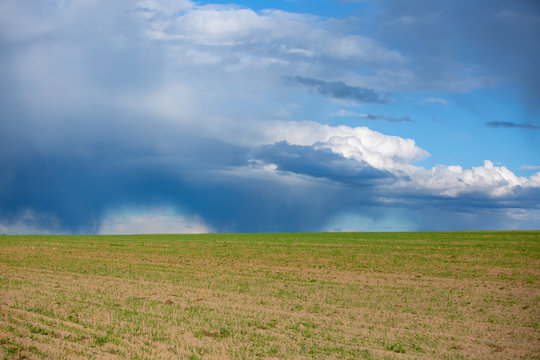 Dark clouds over field before a tunderstorm