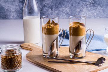 Dalgona coffee with a cool fluffy whipped foam in glasses.