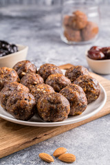 Fruit and nut energy balls in a plate, front view.