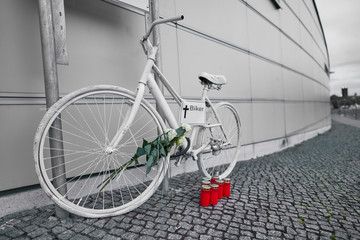 Berlin Germany, white ghost bike as a memorial to a biker who was killed in Berlin city traffic,...