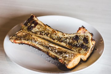 grilled steak on a white plate