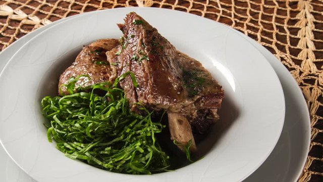 Grilled ribs with cabbage - Traditional brazilian food Costela com couve. Top view with smoke.