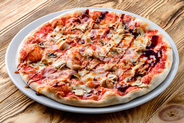 Italian pizza on a thin dough with a variety of stuffed. Mixed media