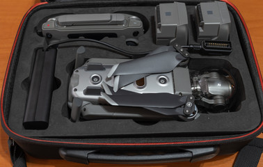 folding drone with all its accessories stored in its rigid and compact suitcase