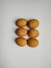 six walnut shells on isolated a white background