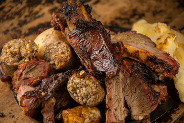 roasted meat on a wooden table
