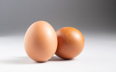 Two eggs on the white backdrop