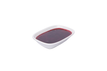 Cherry jam. Jam in white plate on white background. Breakfast menu.