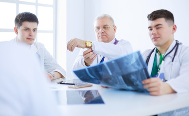 Medical team sitting and discussing at table