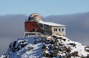 Abandoned snow-covered observatory on the mountain Sierra Nevada of Spain. Winter time