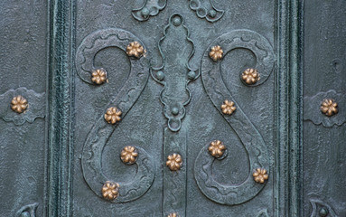 decorative elements of wrought iron grilles in the door and windows