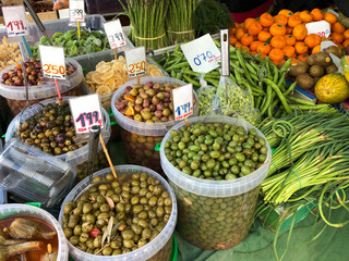 different vegetables, olives, dried fruits on a local market