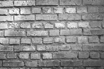 Weathered texture of stained old dark brown and red brick wall background, grungy rusty blocks of stone-work technology, colorful horizontal architecture