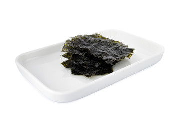 Roasted seaweed, nori seaweed on white plate, on white background (Tr-Yosun yapragi)