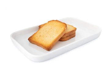Double crispy biscottes, square cracker on white plate, on white background (Tr- etimek)