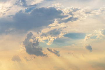 Cloudy with sunshine drift through the evening.