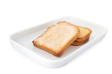 Double crispy biscotti with butter, square cracker on white plate, on white background (Tr- tereyagli etimek)