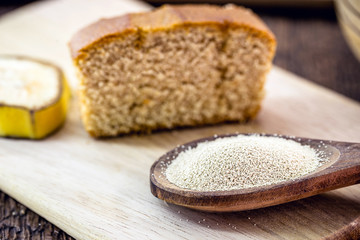 spoon with dry biological yeast, used in organic, vegetarian and vegan products. Healthy vegan life concept.