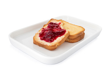 Bitten crispy biscotti with butter and jam, square cracker on white plate, on white background (Tr- recelli etimek)