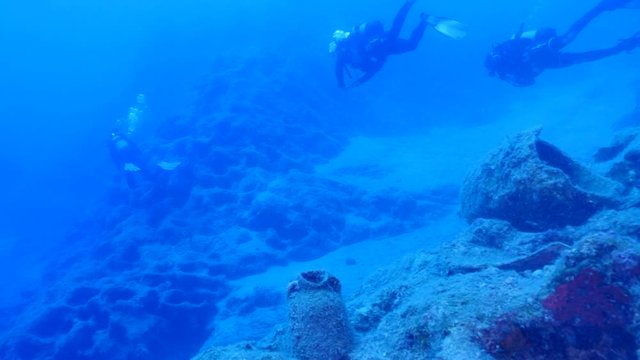 amphora pieces underwater ancient antic amphoras scuba divers exploring and discovering deep water