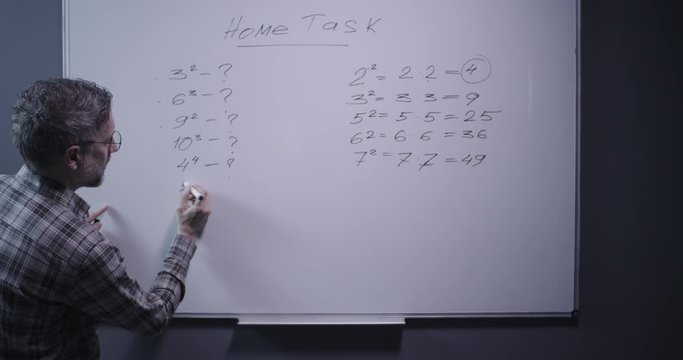 Teacher explaining math to camera