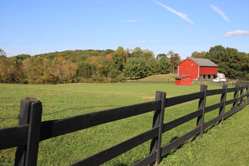 red barn with fence