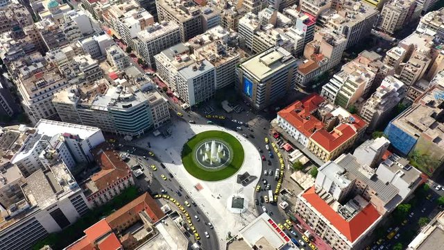 Aerial video 4k of recently renovated fountain of famous round square of Omonia in the heart of Athens centre, Attica, Greece