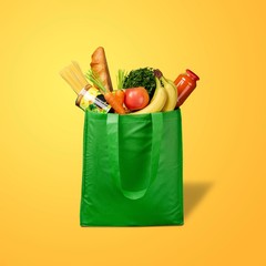 Shopping fabric bag with groceries on desk