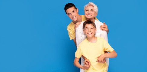 Mother with two sons posing in studio.Mother's day.