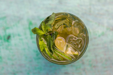 Lemonade with mint and ice cubes. A fresh summer non alcoholic fruit and citrus cocktail.