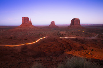 Incredible sunset at Monument Valley , a red-sand desert region on the Arizona-Utah border, Utah. Twlight shot of the buttes at John Ford’s Point.