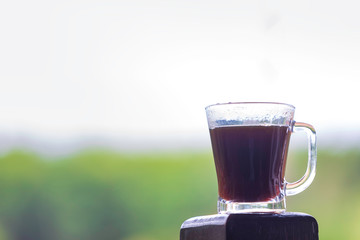 Black coffee in a clear glass in the morning