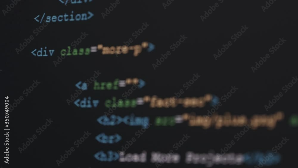 Leinwandbilder 4K Close up shot HTML tag code on PC Monitor scroll down. Background concept for programming and coding web development.