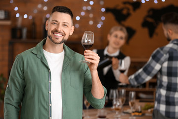 Man tasting wine at the restaurant