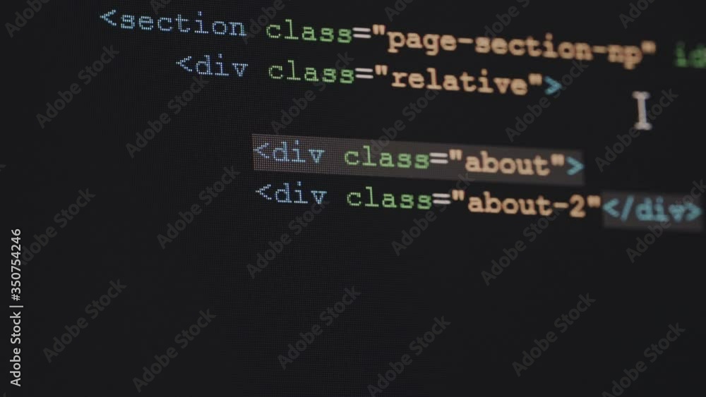 Leinwandbilder 4K Close up shot HTML tag code input on PC Monitor. Background concept for programming and coding web development.