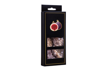 Dried fruit figs in black packaging isolated on a white background.