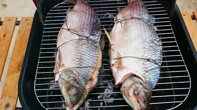 Hot fish on a grill. Caribbean food concept