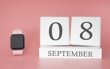 Modern Watch with cube calendar and date 08 september on pink background. Concept autumn time vacation.