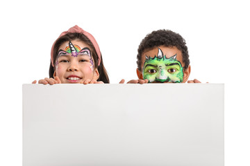 Funny little children with face painting and blank poster on white background