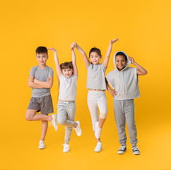 Obraz premium Cute little dancers on color background