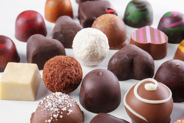 Delicious candies on white background