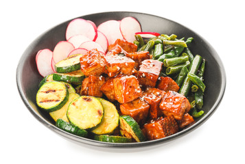 Bowl with tasty tofu cheese and vegetables on white background