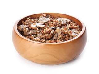 Bowl of tasty buckwheat porridge and mushrooms on white background