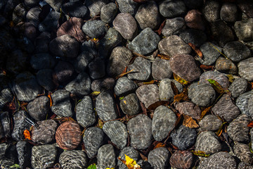 Stones and water in a beautiful morning in Amatitlán, Guatemala